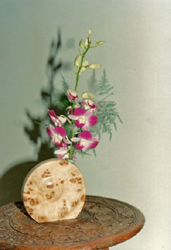 Photo - A simple personal display<br>
featuring a Turned Wooden
 vase made	by Bill
